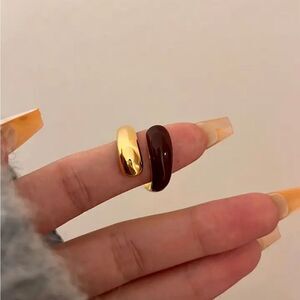 Black and silver ring. One size fits all. NEW